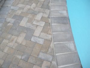 New Tile & Coping with Patio Stone Deck
