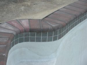 New Patio Stone Coping with Concrete Deck