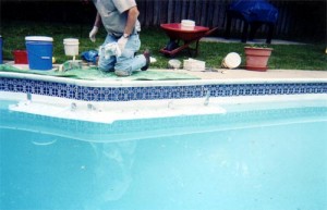 Tile repair on pool walls